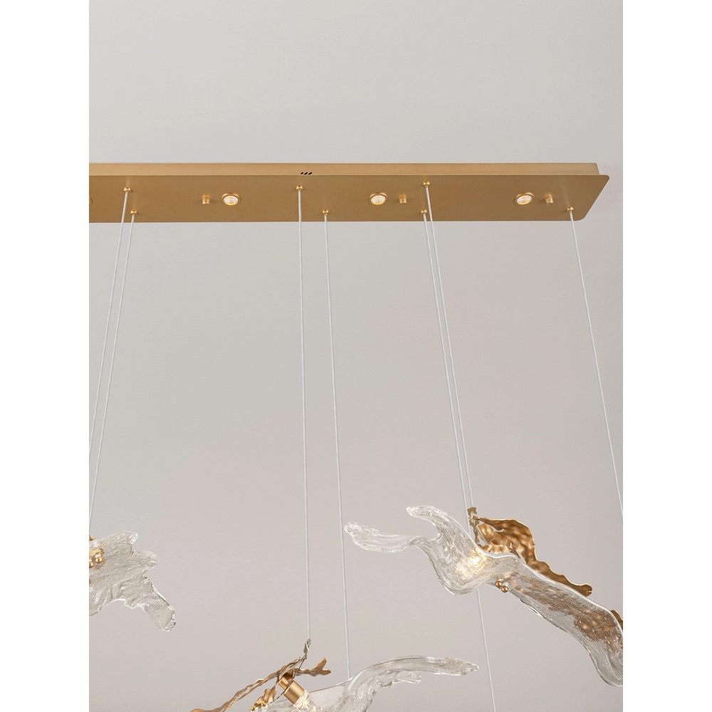 Lampe pendante dorée Avesa avec verre transparent 128 cm Lyora 5212063500426